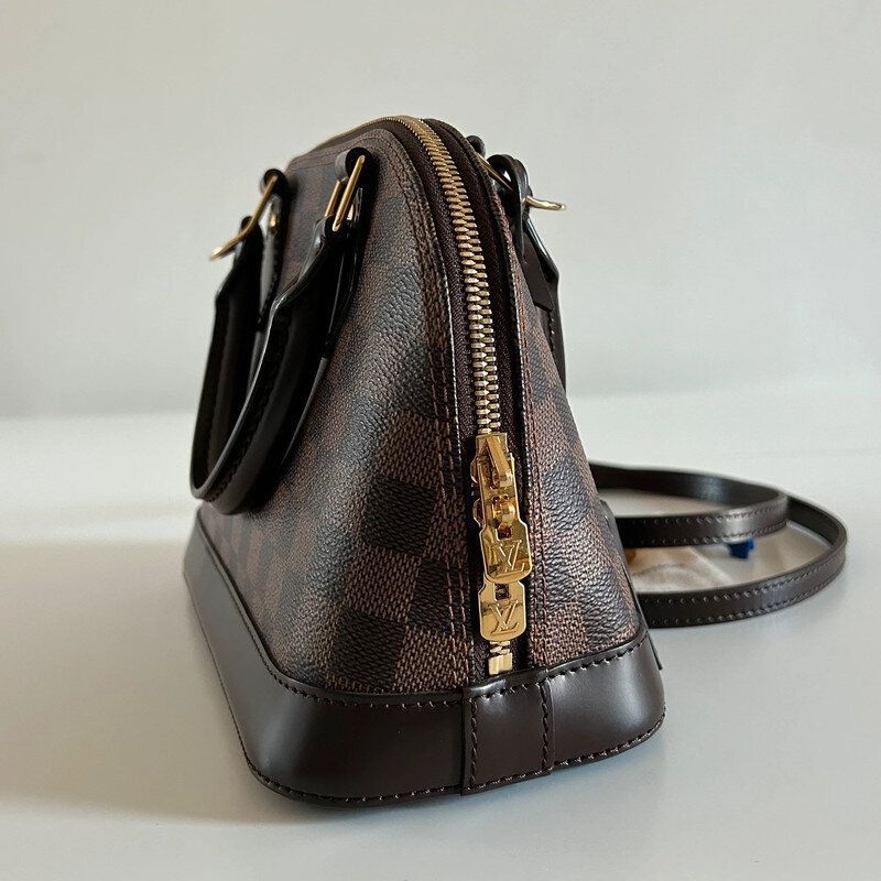LOUIS VUITTON ALMA BB DAMIER EBENE FULL SET. AUTHENTIQUE SAC DE LUXE DE SECONDE MAIN CERTIFICAT D'AUTHENTICITE ENTRUPY. SAC D'OCCASION LV