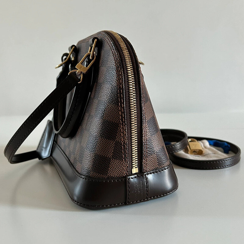 LOUIS VUITTON ALMA BB DAMIER EBENE FULL SET. AUTHENTIQUE SAC DE LUXE DE SECONDE MAIN CERTIFICAT D'AUTHENTICITE ENTRUPY. SAC D'OCCASION LV