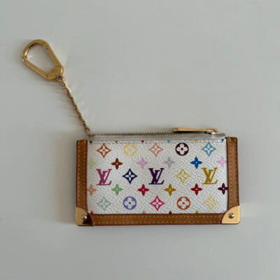 LOUIS VUITTON POCHETTE CLES MURAKAMI TAKASHI MONOGRAM MULTICOLORE BLANC. LUXE DE SECONDE MAIN. PORTE-CLES D'OCCASION AUTHENTIQUE CERTIFICAT D'AUTHENTICITE ENTRUPY