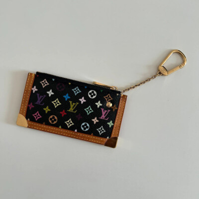 LOUIS VUITTON POCHETTE CLES MURAKAMI TAKASHI MONOGRAM MULTICOLORE NOIRE. LUXE DE SECONDE MAIN. PORTE-CLES D'OCCASION AUTHENTIQUE CERTIFICAT D'AUTHENTICITE ENTRUPY