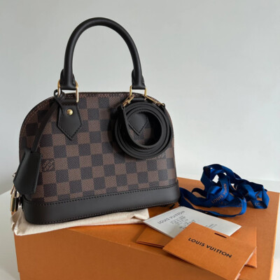 LOUIS VUITTON ALMA BB EN TOILE DAMIER EBENE NEUF FULL SET. SAC DE LUXE D'OCCASION PAS CHER. SAC DE SECONDE MAIN AUTHENTIQUE CERTIFICAT D'AUTHENTICITE ENTRUPY
