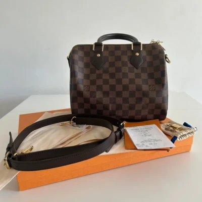 Louis Vuitton speedy 25 bandoulière damier ébène. SAC DE LUXE DE SECONDE MAIN AUTHENTIQUE CERTIFICAT D'AUTHENTICITE ENTRUPY. SAC DE LUXE D'OCCASION PAS CHER