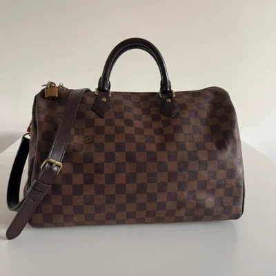 Louis Vuitton speedy 35 bandoulière damier ébène. SAC DE LUXE DE SECONDE MAIN AUTHENTIQUE CERTIFICAT D'AUTHENTICITE ENTRUPY. SAC DE LUXE D'OCCASION PAS CHER