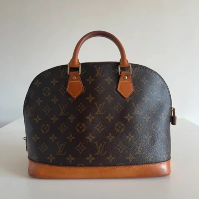 Louis Vuitton sac Alma PM toile monogram. SAC DE LUXE DE SECONDE MAIN AUTHENTIQUE CERTIFICAT D'AUTHENTICITE ENTRUPY. SAC DE LUXE D'OCCASION PAS CHER.