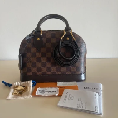 Louis Vuitton Alma BB damier ébène FULL SET SAC DE LUXE DE SECONDE MAIN AUTHENTIQUE CERTIFICAT D'AUTHENTICITE ENTRUPY. SAC DE LUXE D'OCCASION PAS CHER.