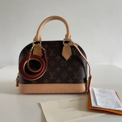 Louis Vuitton Alma BB monogram NEUF FULL SET. SAC DE LUXE DE SECONDE MAIN AUTHENTIQUE CERTIFICAT D'AUTHENTICITE ENTRUPY. SAC DE LUXE D'OCCASION PAS CHER.