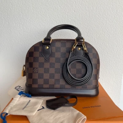 Louis Vuitton Alma BB damier ébène FULL SET SAC DE LUXE DE SECONDE MAIN AUTHENTIQUE CERTIFICAT D'AUTHENTICITE ENTRUPY. SAC DE LUXE D'OCCASION PAS CHER.