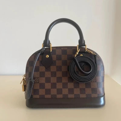 Louis Vuitton Alma BB damier ébène FULL SET SAC DE LUXE DE SECONDE MAIN AUTHENTIQUE CERTIFICAT D'AUTHENTICITE ENTRUPY. SAC DE LUXE D'OCCASION PAS CHER.