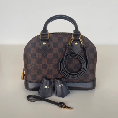 Louis Vuitton Alma BB damier ébène SAC DE LUXE DE SECONDE MAIN AUTHENTIQUE CERTIFICAT D'AUTHENTICITE ENTRUPY. SAC DE LUXE D'OCCASION PAS CHER.