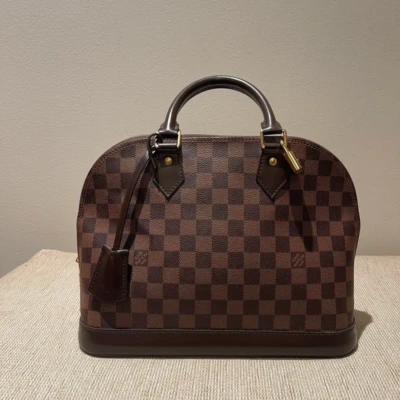 Louis Vuitton Alma PM damier ébène SAC DE LUXE DE SECONDE MAIN AUTHENTIQUE CERTIFICAT D'AUTHENTICITE ENTRUPY. SAC DE LUXE D'OCCASION PAS CHER.