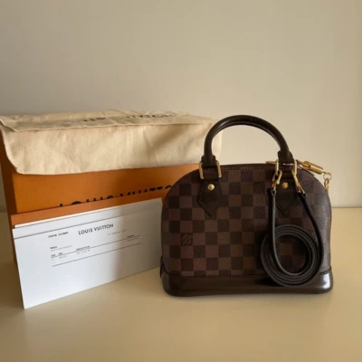 Louis Vuitton Alma BB damier ébène SAC DE LUXE DE SECONDE MAIN AUTHENTIQUE CERTIFICAT D'AUTHENTICITE ENTRUPY. SAC DE LUXE D'OCCASION PAS CHER. LOUIS VUITTON FULL SET