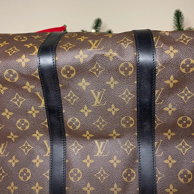 Louis Vuitton keepall bandoulière 55 monogram macassar. SAC DE LUXE DE SECONDE MAIN AUTHENTIQUE CERTIFICAT D'AUTHENTICITE ENTRUPY. SAC DE LUXE D'OCCASION PAS CHER. SAC DE VOYAGE DE LUXE