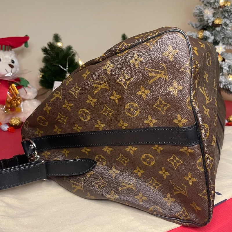 Louis Vuitton keepall bandoulière 55 monogram macassar. SAC DE LUXE DE SECONDE MAIN AUTHENTIQUE CERTIFICAT D'AUTHENTICITE ENTRUPY. SAC DE LUXE D'OCCASION PAS CHER. SAC DE VOYAGE DE LUXE