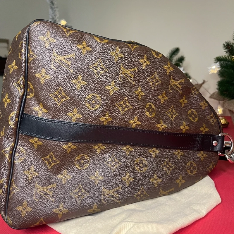 Louis Vuitton keepall bandoulière 55 monogram macassar. SAC DE LUXE DE SECONDE MAIN AUTHENTIQUE CERTIFICAT D'AUTHENTICITE ENTRUPY. SAC DE LUXE D'OCCASION PAS CHER. SAC DE VOYAGE DE LUXE