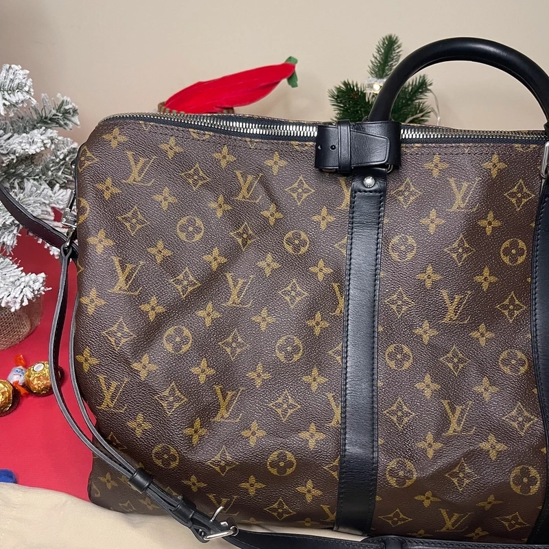 Louis Vuitton keepall bandoulière 55 monogram macassar. SAC DE LUXE DE SECONDE MAIN AUTHENTIQUE CERTIFICAT D'AUTHENTICITE ENTRUPY. SAC DE LUXE D'OCCASION PAS CHER. SAC DE VOYAGE DE LUXE
