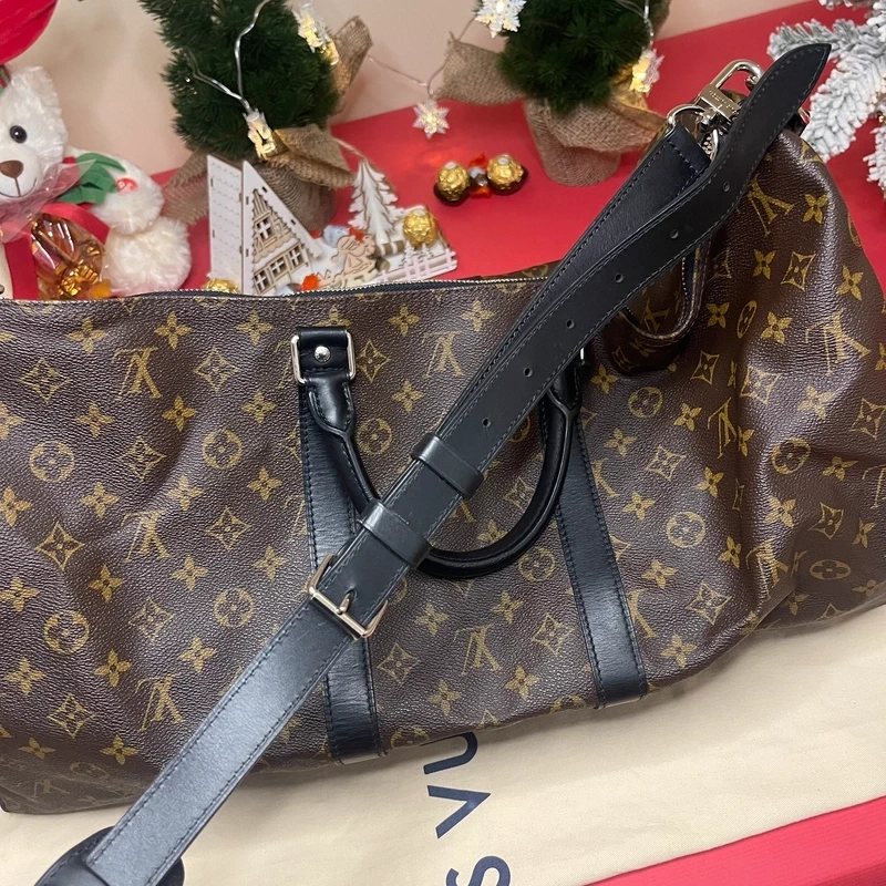 Louis Vuitton keepall bandoulière 55 monogram macassar. SAC DE LUXE DE SECONDE MAIN AUTHENTIQUE CERTIFICAT D'AUTHENTICITE ENTRUPY. SAC DE LUXE D'OCCASION PAS CHER. SAC DE VOYAGE DE LUXE
