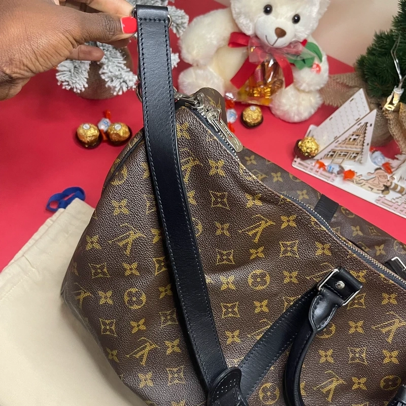 Louis Vuitton keepall bandoulière 55 monogram macassar. SAC DE LUXE DE SECONDE MAIN AUTHENTIQUE CERTIFICAT D'AUTHENTICITE ENTRUPY. SAC DE LUXE D'OCCASION PAS CHER. SAC DE VOYAGE DE LUXE