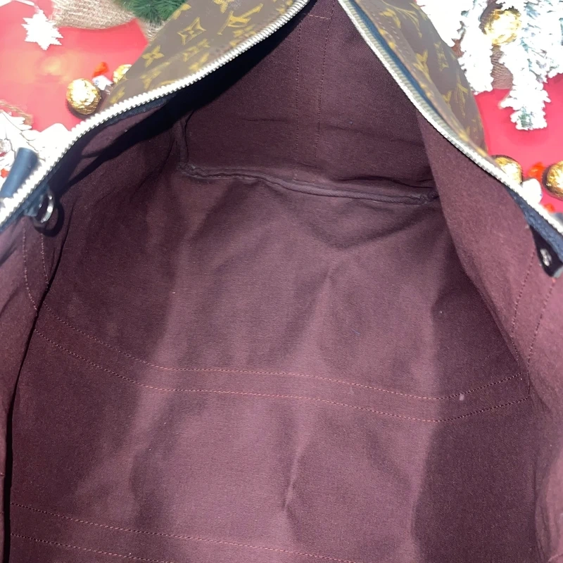 Louis Vuitton keepall bandoulière 55 monogram macassar. SAC DE LUXE DE SECONDE MAIN AUTHENTIQUE CERTIFICAT D'AUTHENTICITE ENTRUPY. SAC DE LUXE D'OCCASION PAS CHER. SAC DE VOYAGE DE LUXE