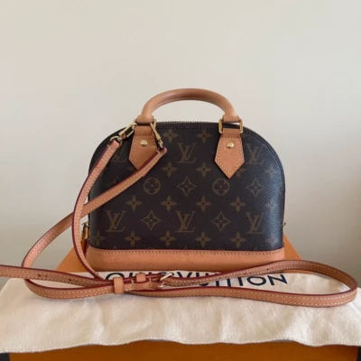 LOUIS VUITTON Alma monogram SAC DE LUXE DE SECONDE MAIN AUTHENTIQUE CERTIFICAT D'AUTHENTICITE ENTRUPY. SAC DE LUXE D'OCCASION PAS CHER. LOUIS VUITTON FULL SET