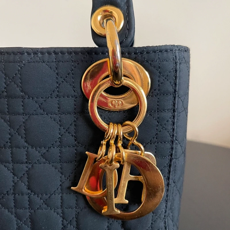 Dior sac Lady dior mini en nylon noir bijouterie dorée LUXE DE SECONDE MAIN AUTHENTIQUE CERTIFICAT D'AUTHENTICITE ENTRUPY. SAC DE LUXE D'OCCASION PAS CHER DIOR FULL SET