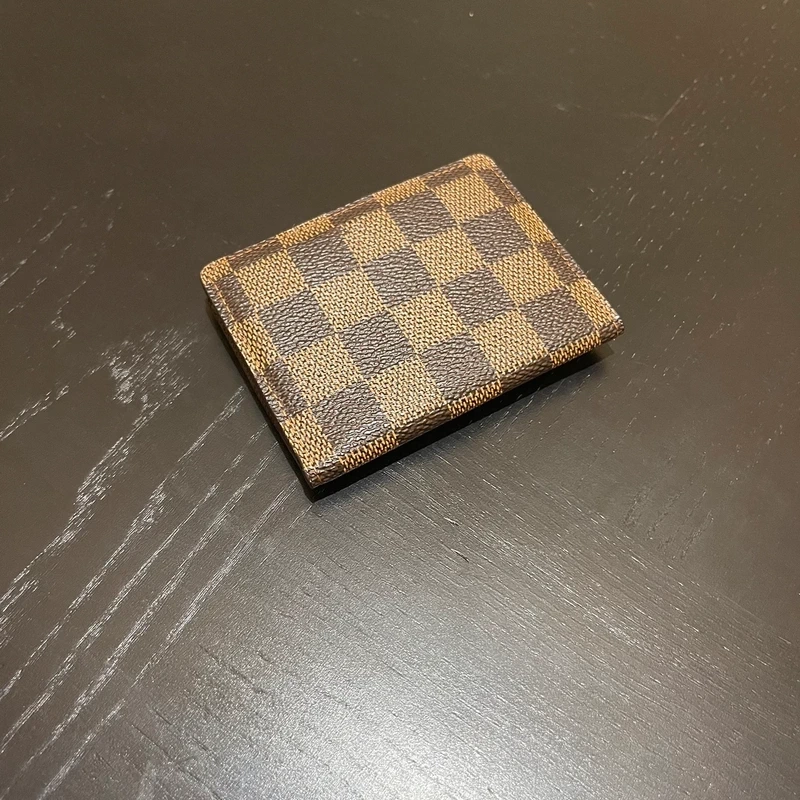 Louis Vuitton petit portefeuille bifold damier ébène LUXE DE SECONDE MAIN AUTHENTIQUE CERTIFICAT D'AUTHENTICITE ENTRUPY. LUXE D'OCCASION PAS CHER.