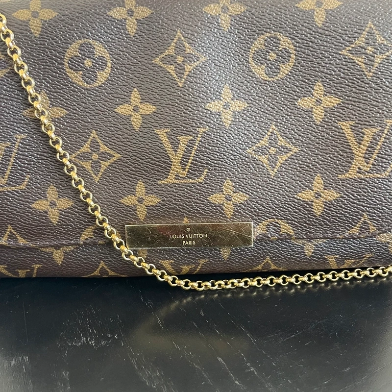 Louis Vuitton pochette Favorite monogram SAC DE LUXE DE SECONDE MAIN AUTHENTIQUE CERTIFICAT D'AUTHENTICITE ENTRUPY. SAC DE LUXE D'OCCASION PAS CHER. LOUIS VUITTON FULL SET