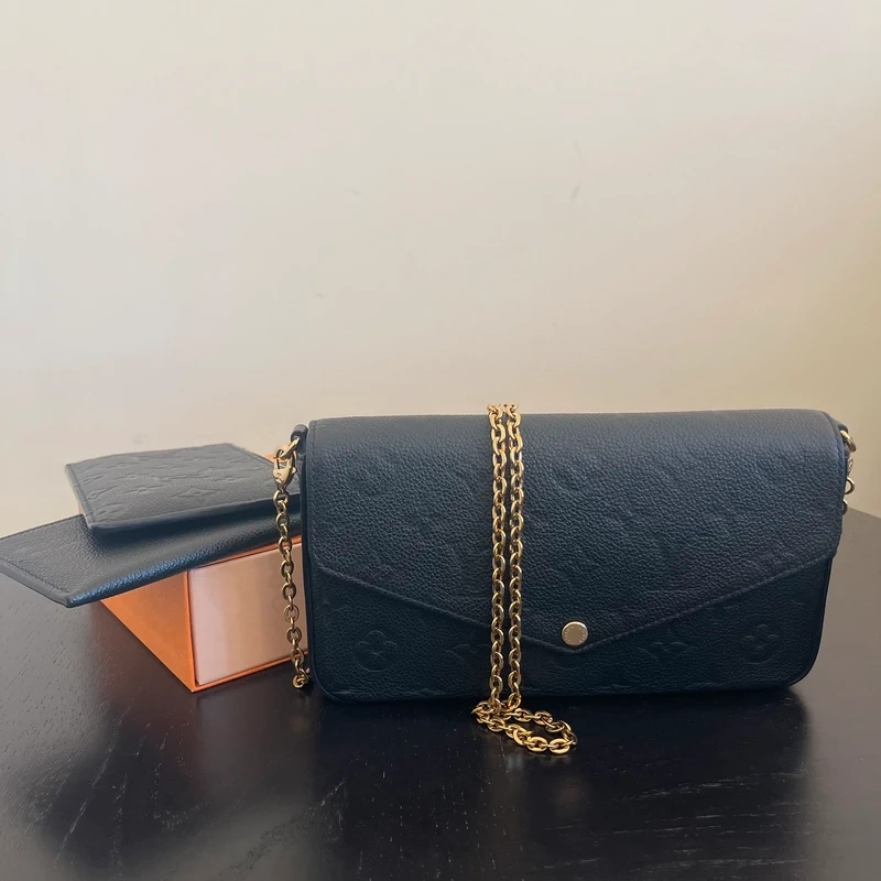 LOUIS VUITTON Félicie en cuir monogram empreinte noir SAC DE LUXE DE SECONDE MAIN AUTHENTIQUE CERTIFICAT D'AUTHENTICITE ENTRUPY. SAC DE LUXE D'OCCASION PAS CHER LV FULL SET.