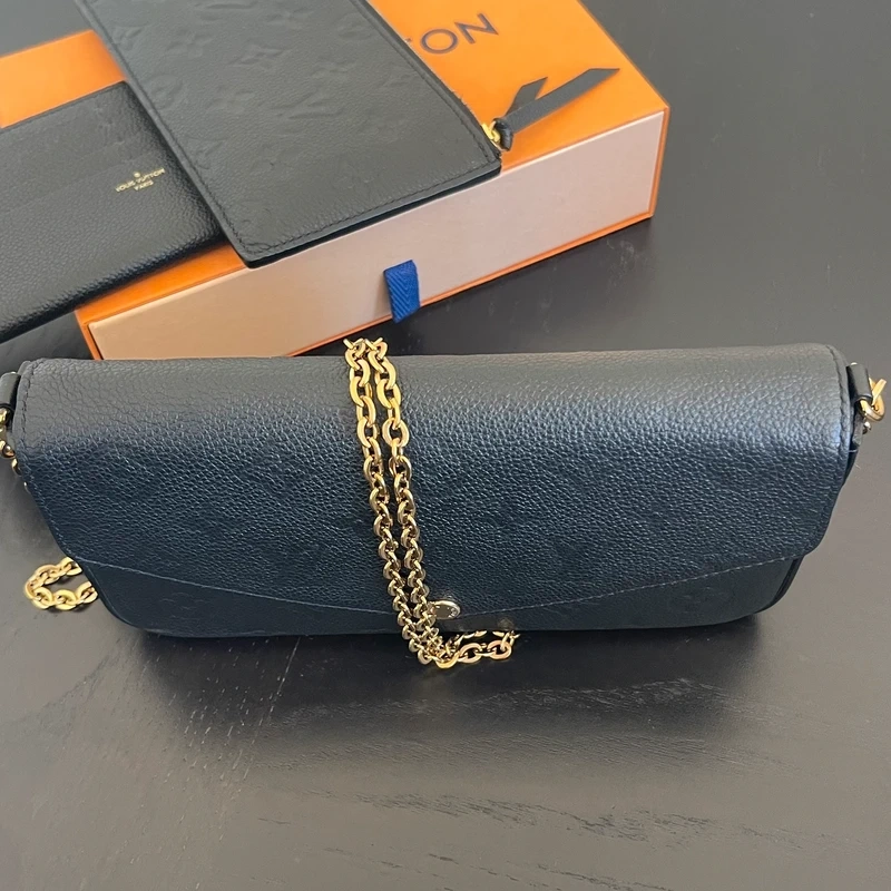 LOUIS VUITTON Félicie en cuir monogram empreinte noir SAC DE LUXE DE SECONDE MAIN AUTHENTIQUE CERTIFICAT D'AUTHENTICITE ENTRUPY. SAC DE LUXE D'OCCASION PAS CHER LV FULL SET.