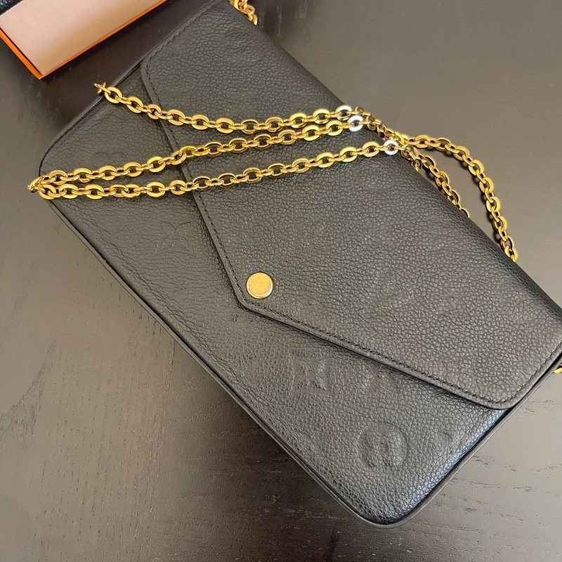 LOUIS VUITTON Félicie en cuir monogram empreinte noir SAC DE LUXE DE SECONDE MAIN AUTHENTIQUE CERTIFICAT D'AUTHENTICITE ENTRUPY. SAC DE LUXE D'OCCASION PAS CHER LV FULL SET.