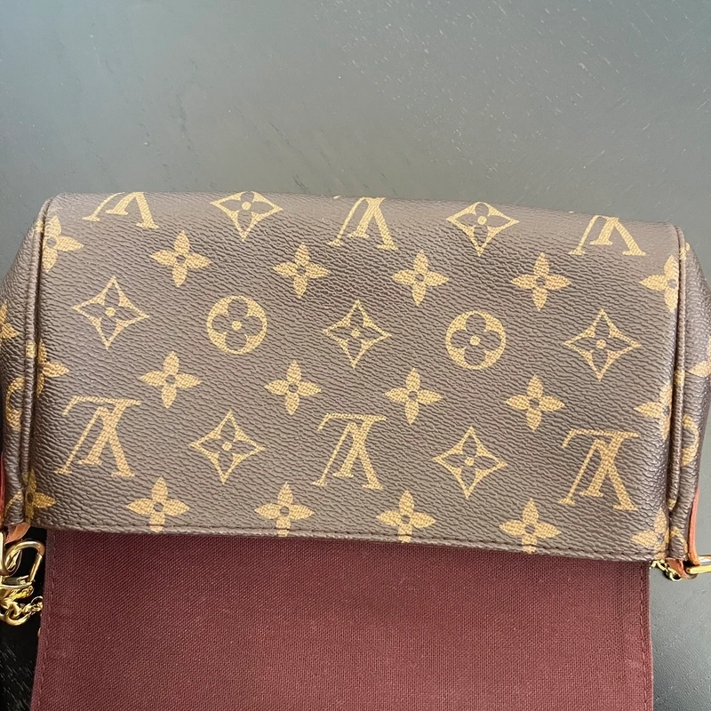 LOUIS VUITTON pochette favorite monogram SAC DE LUXE LV. LUXE DE SECONDE MAIN AUTHENTIQUE. ENTRUPY CERTIFICATE