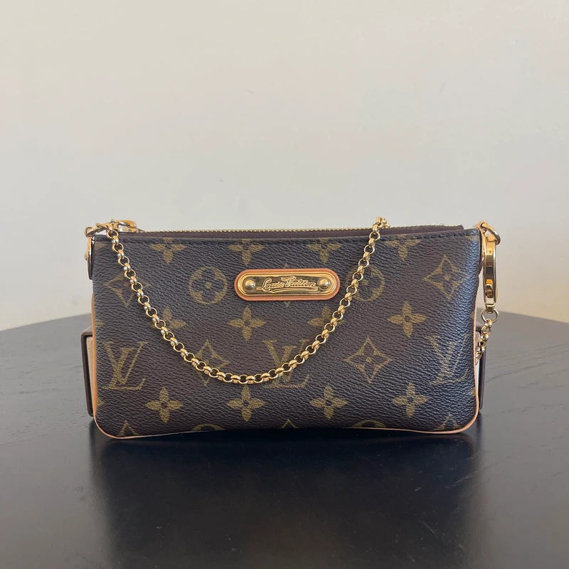 Louis Vuitton Milla monogram SAC DE LUXE DE SECONDE MAIN AUTHENTIQUE. PETITE MAROQUINERIE DE LUXE. ENTRUPY CERTIFICATE