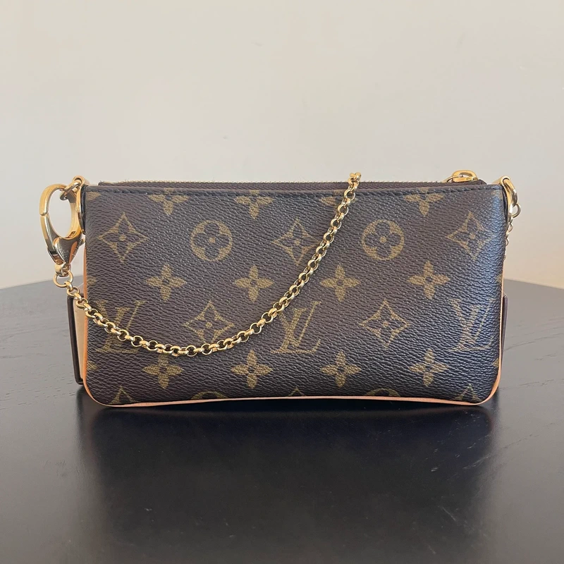 Louis Vuitton Milla monogram SAC DE LUXE DE SECONDE MAIN AUTHENTIQUE. PETITE MAROQUINERIE DE LUXE. ENTRUPY CERTIFICATE
